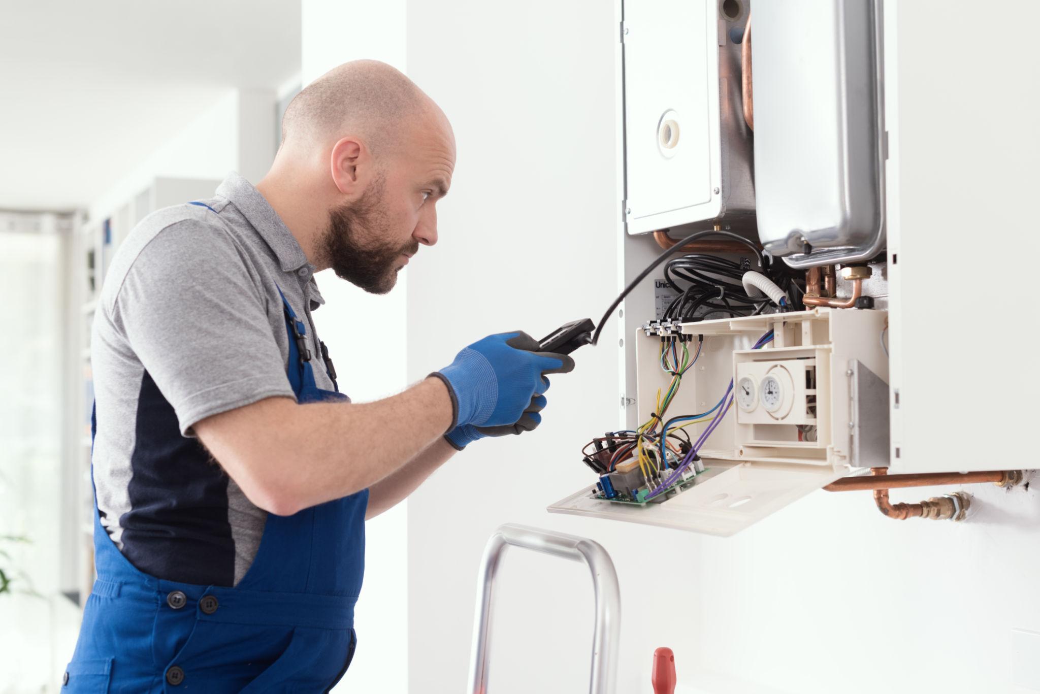 Specialist checking boiler electronics